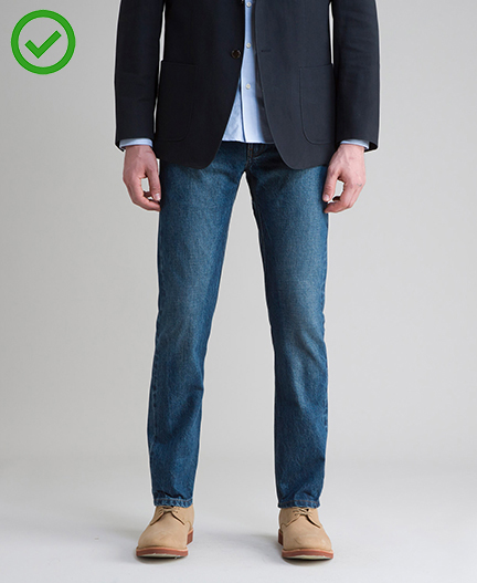Business casual jeans of mid color with no distressing.