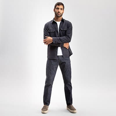 Todd Shelton jeans on man wearing a dark grey shirt