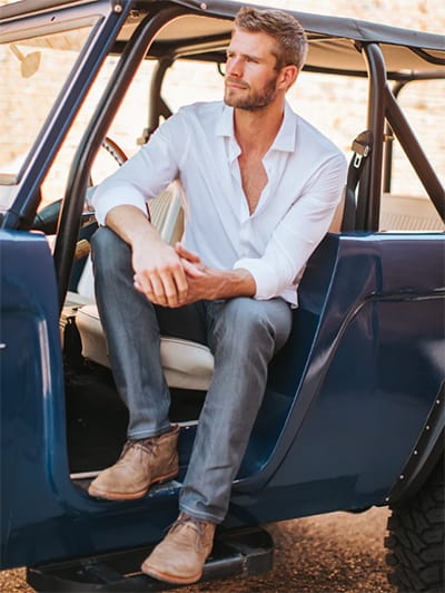 Man in vintage truck wearing Blue Delta jeans